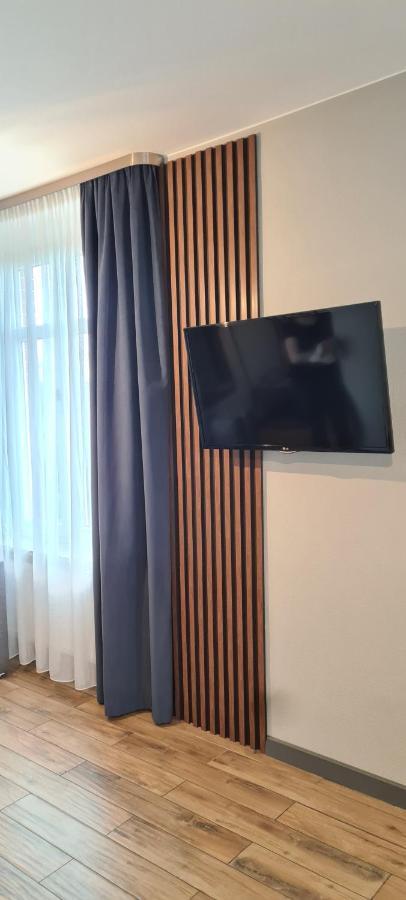 Apartsuites I Sorau ジャリ エクステリア 写真 A wall-mounted television